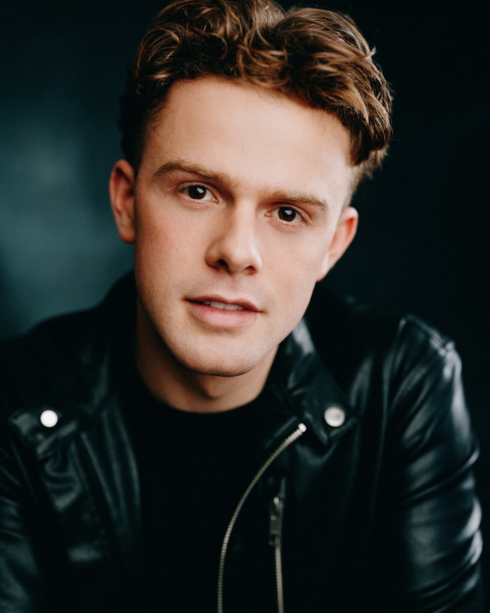 Toronto actor headshot wearing a leather jacket with an urban, edgy expression