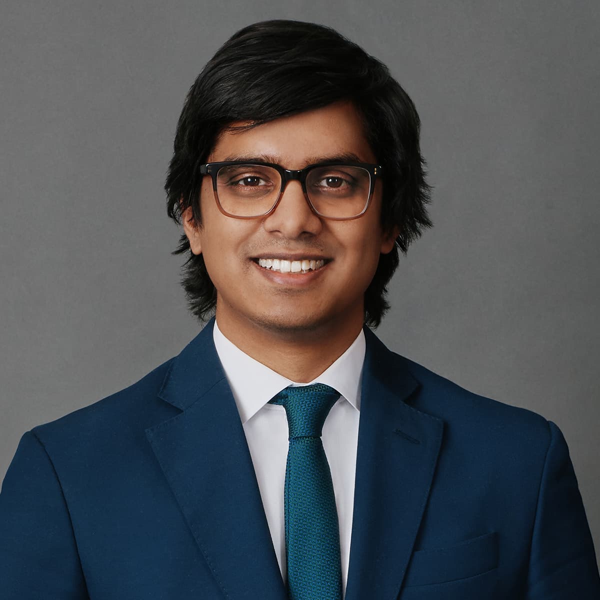 Executive portrait man charcoal blazer studio