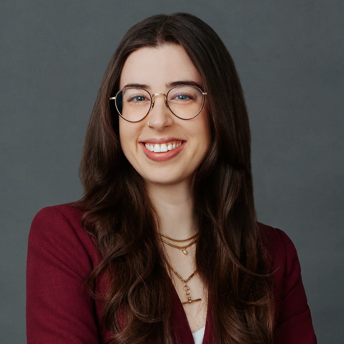 Professional headshot woman glasses approachable Toronto