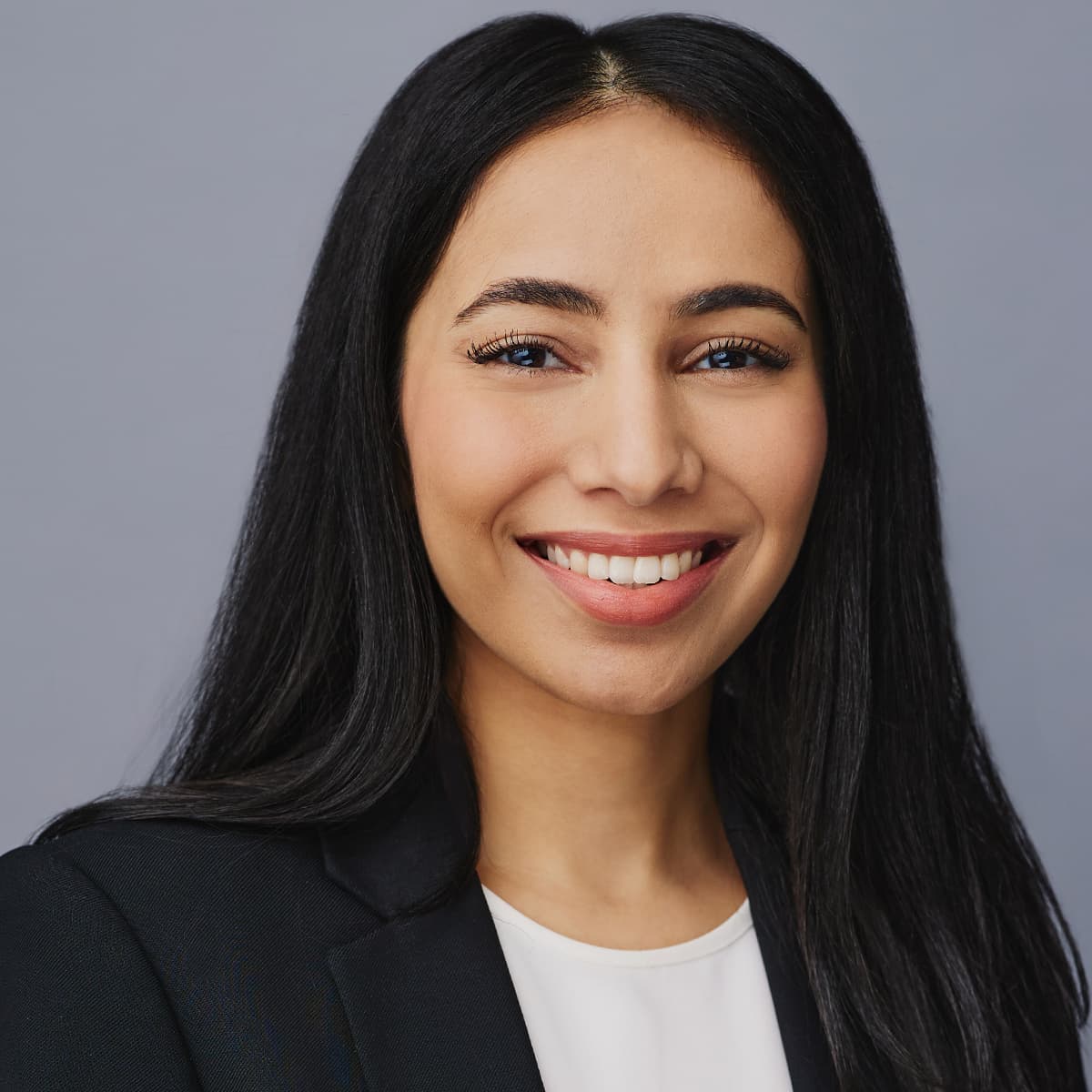 Professional headshot woman warm smile natural light