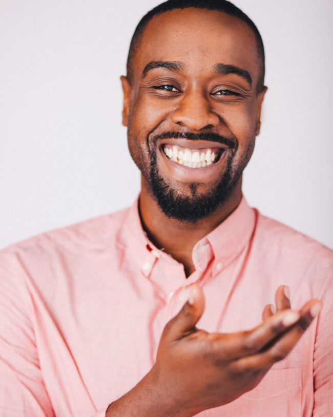 laughing black actor with huge smile