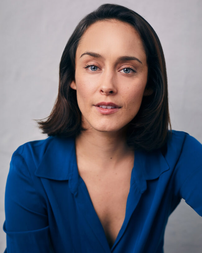actress in vibrant blue blouse