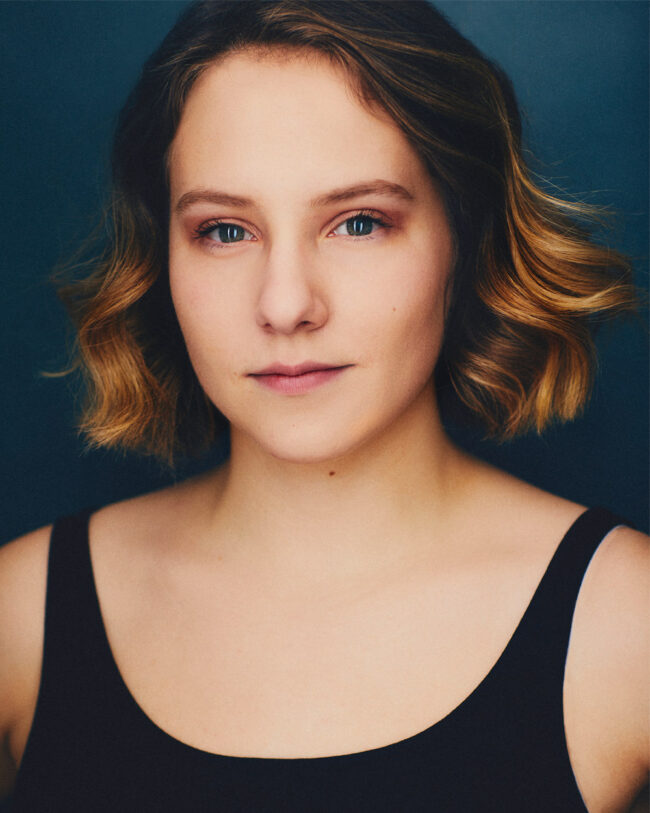 actress with short hair looking serious