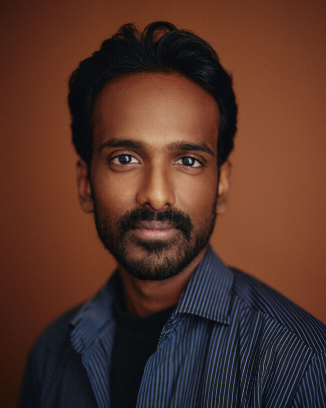 actor portrait with orange background