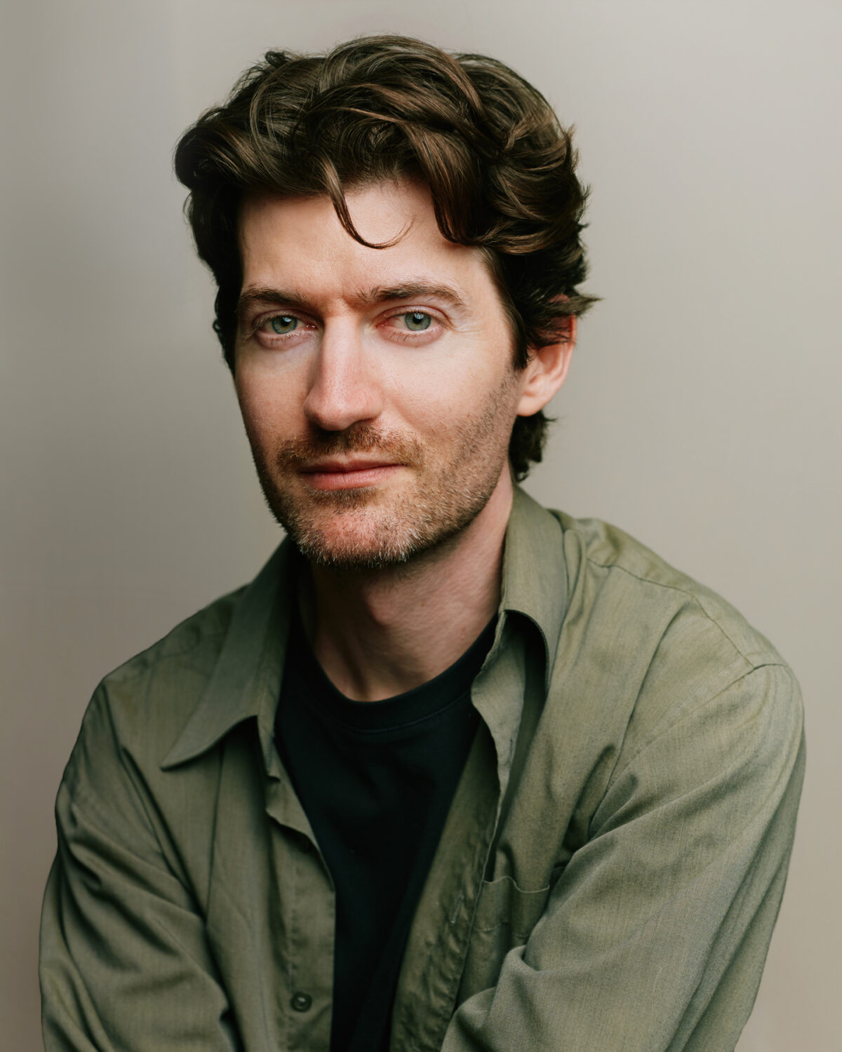 portrait of a man in green shirt